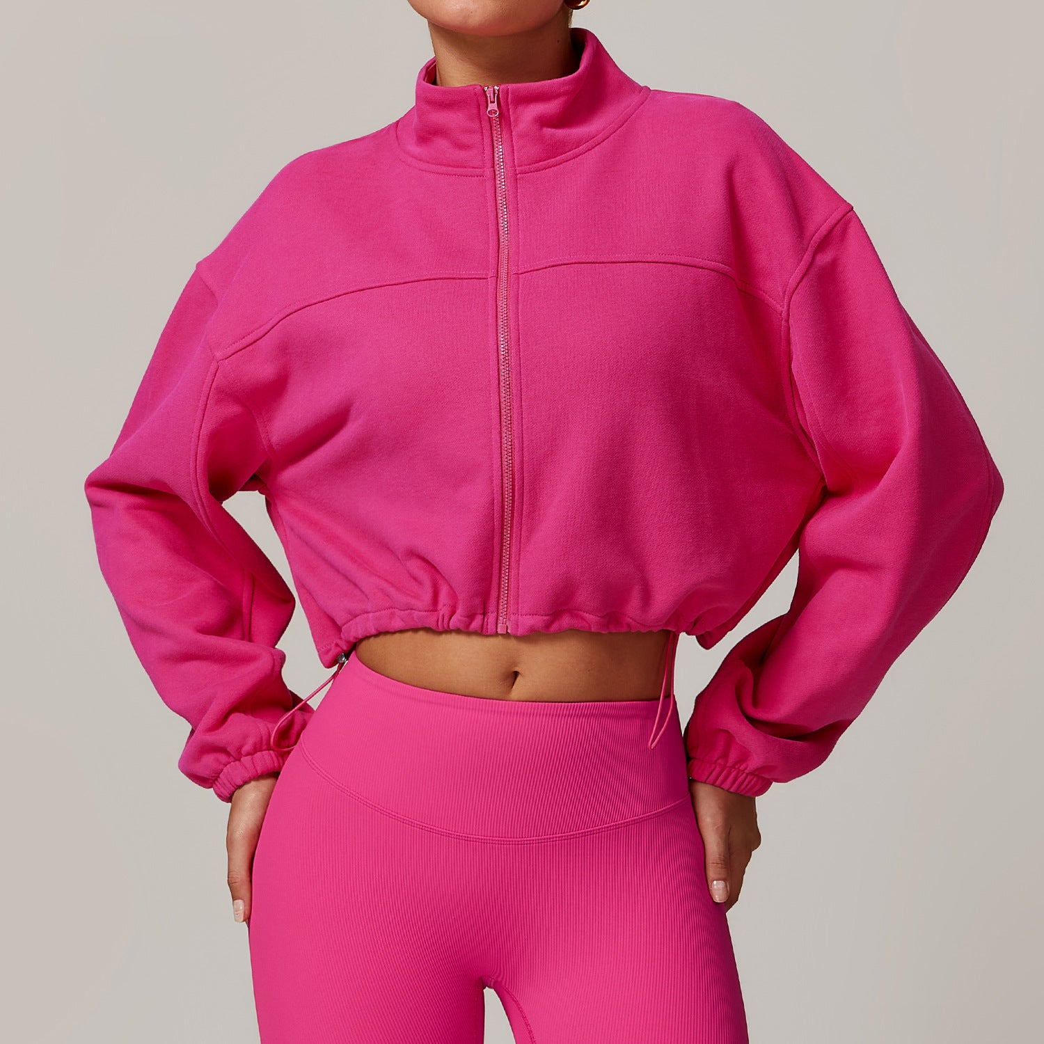 Hot pink cropped athletic jacket and matching leggings for stylish fitness fashion ملابس