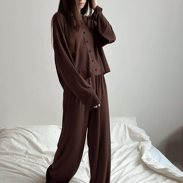 Woman wearing soft, comfortable long sleeve pants and matching cardigan in dark brown