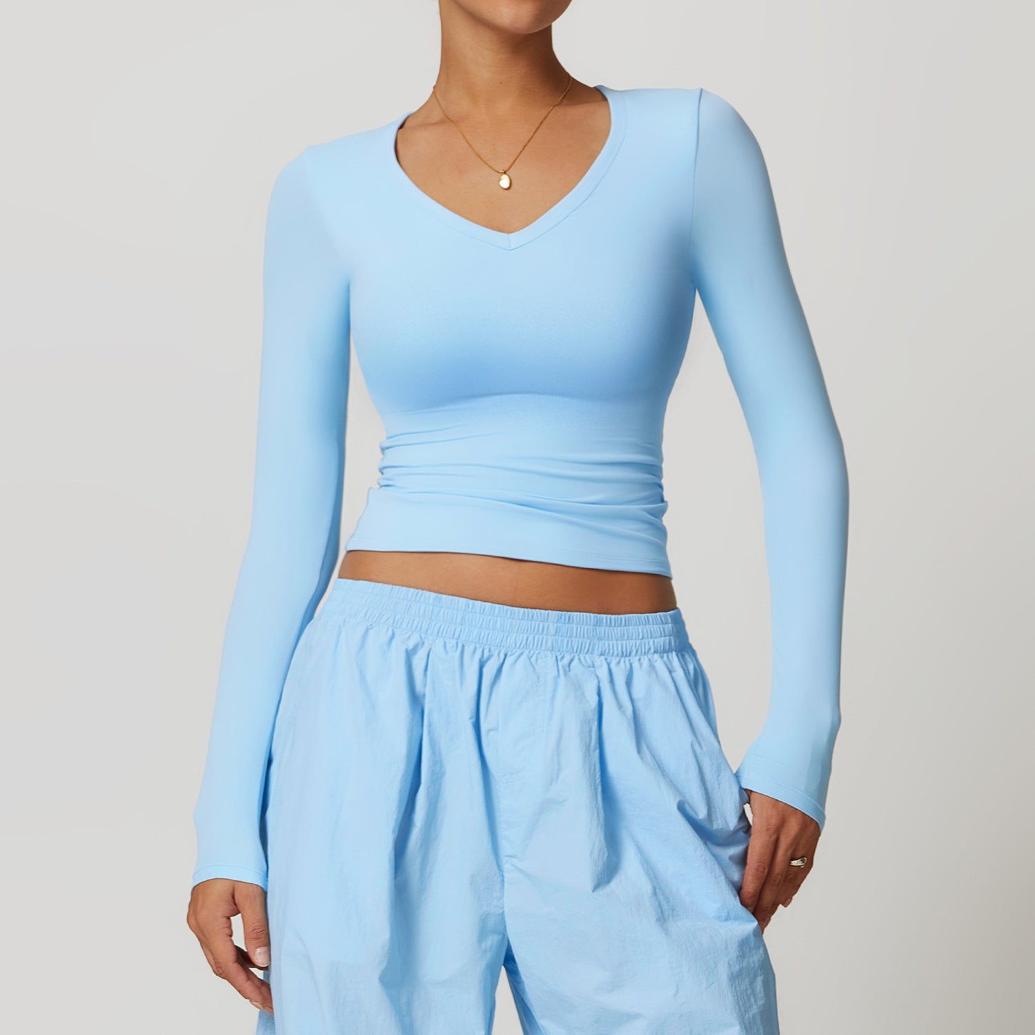 Light blue long-sleeved top and matching pants from Winter Quick Drying Brushed Tight Yoga T shirt collection in Langry fashion perfect for ملابس winter yoga