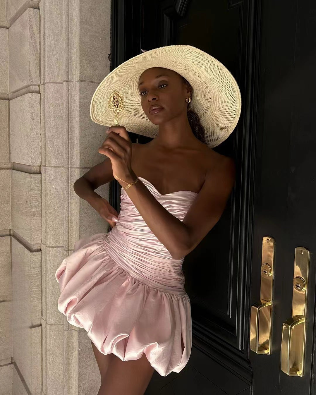 Elegant pink ruched mini dress with strapless neckline, perfect for trendy fashion ملابس