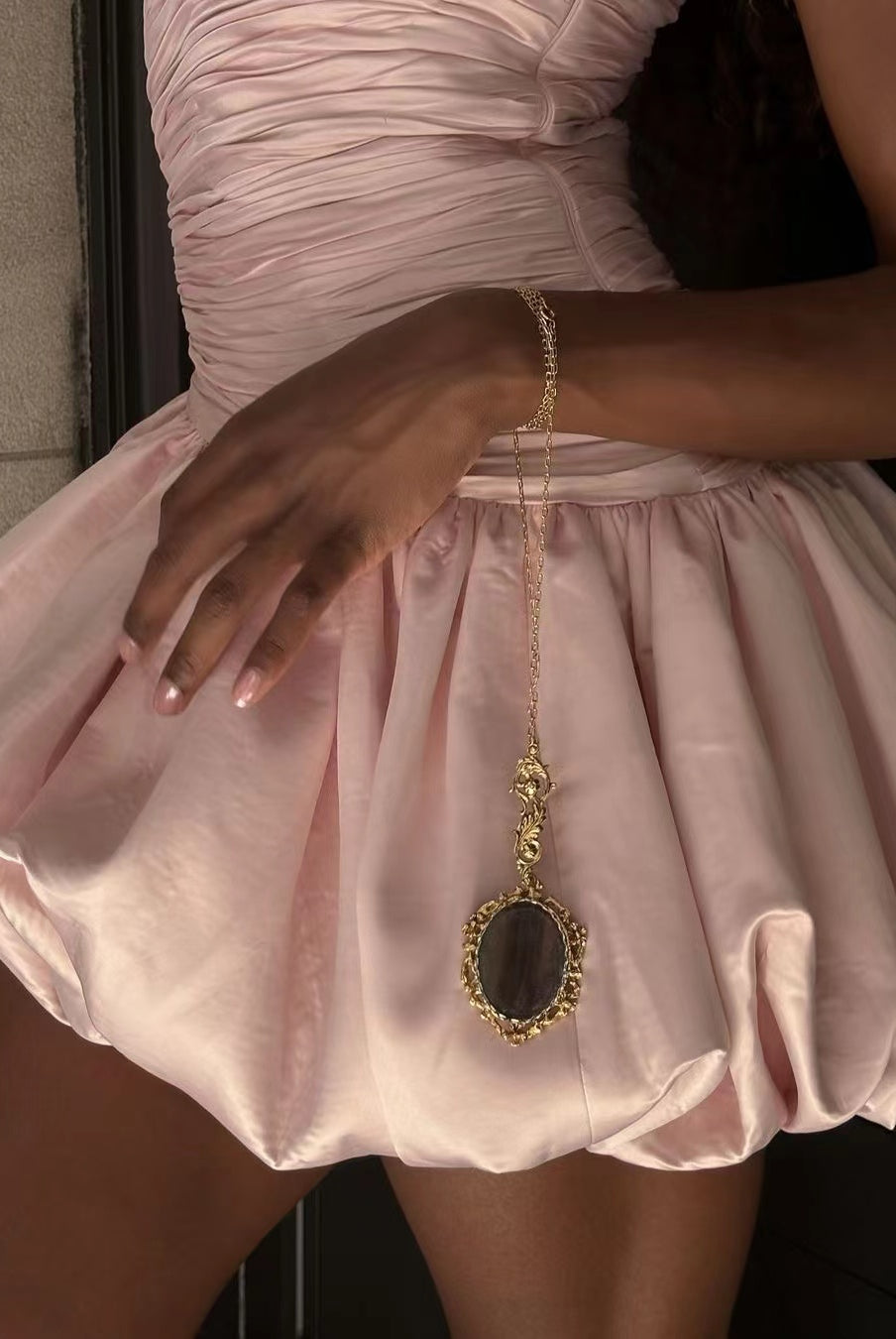 Ornate gold pendant necklace with dark stone enhances Elegant Short Dress in fashion ملابس