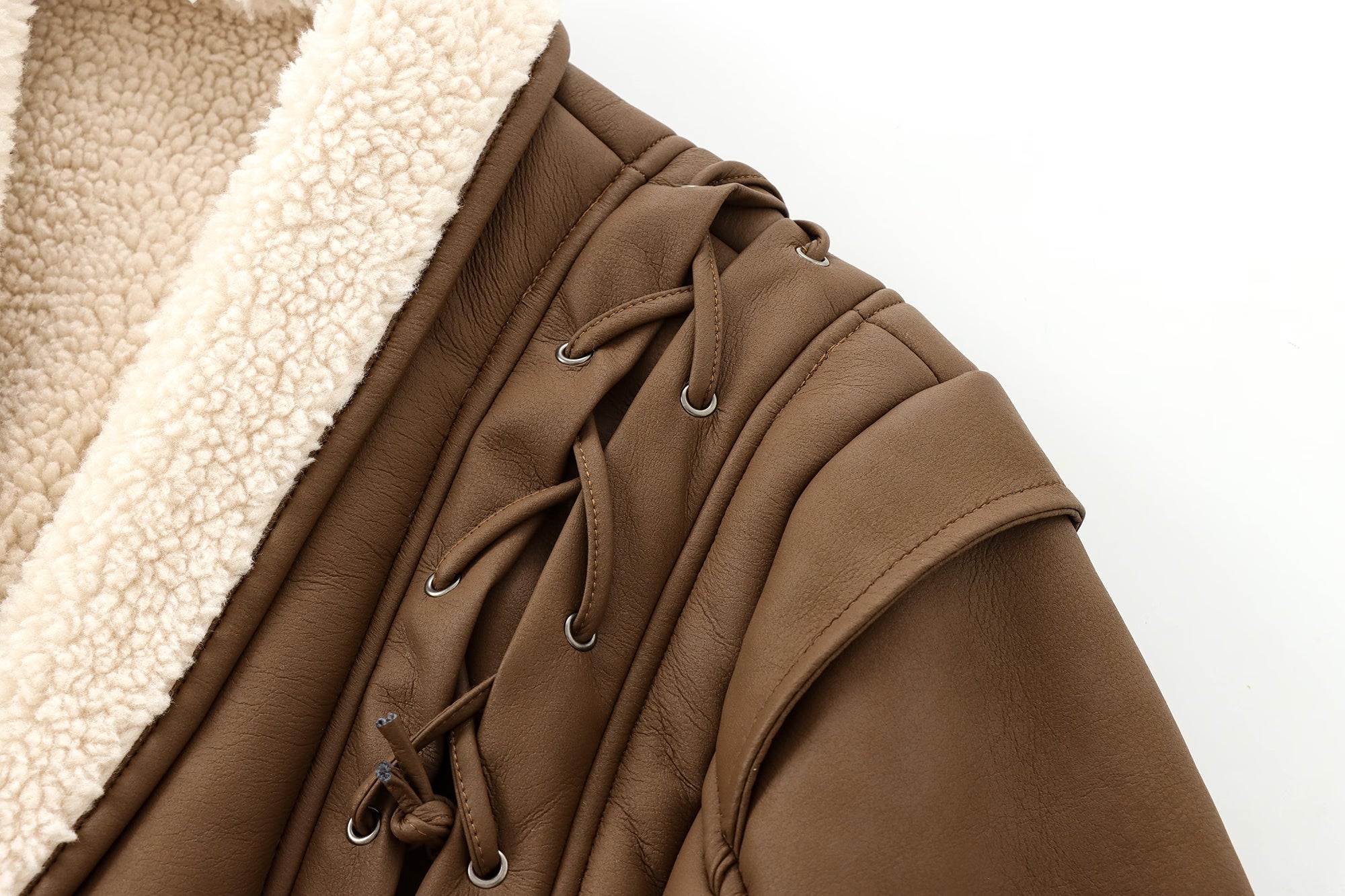 Brown faux leather jacket with sherpa lining and lace-up detail for stylish، langry fashion and ملابس