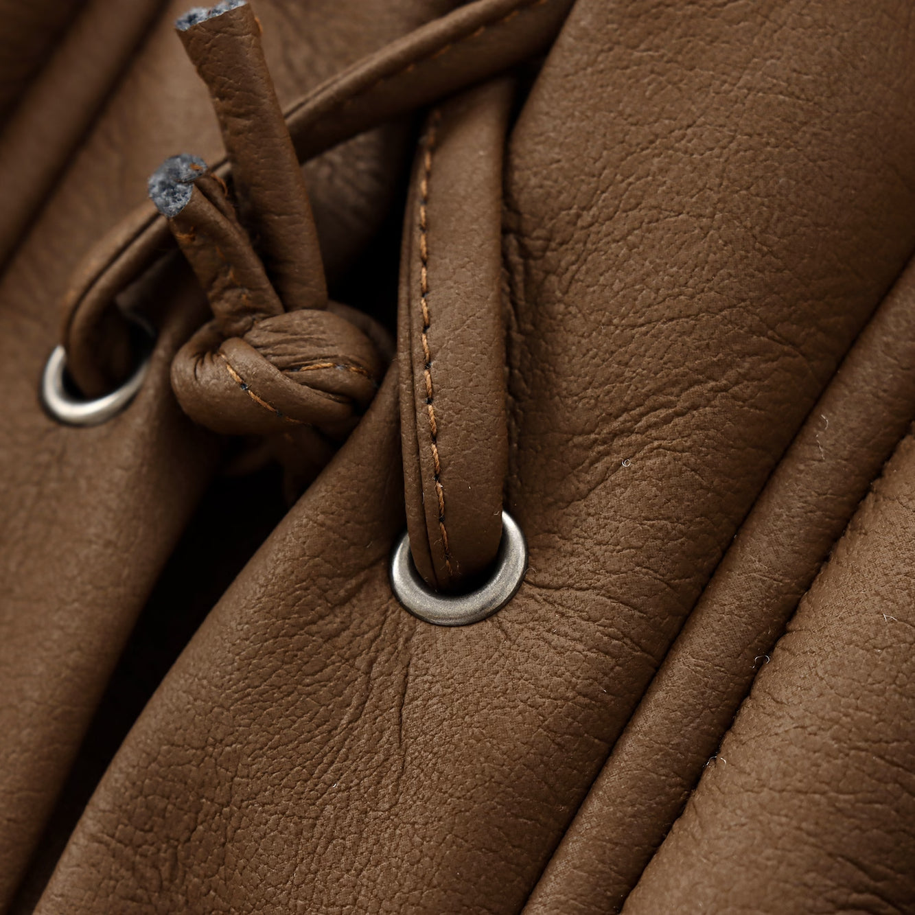 Brown leather drawstring closure detail on Cozy Leather Jacket showcasing fashion and ملابس