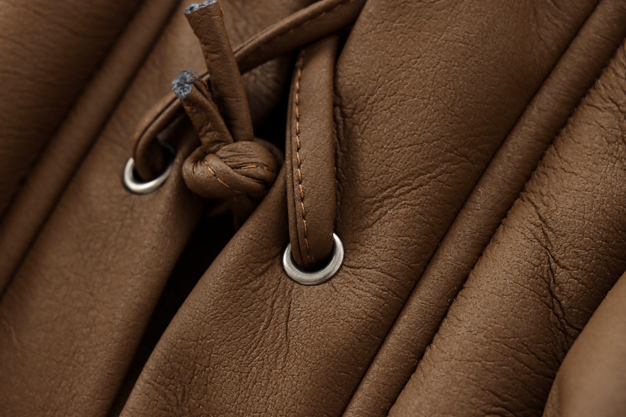 Brown leather drawstring closure detail on Cozy Leather Jacket showcasing fashion and ملابس