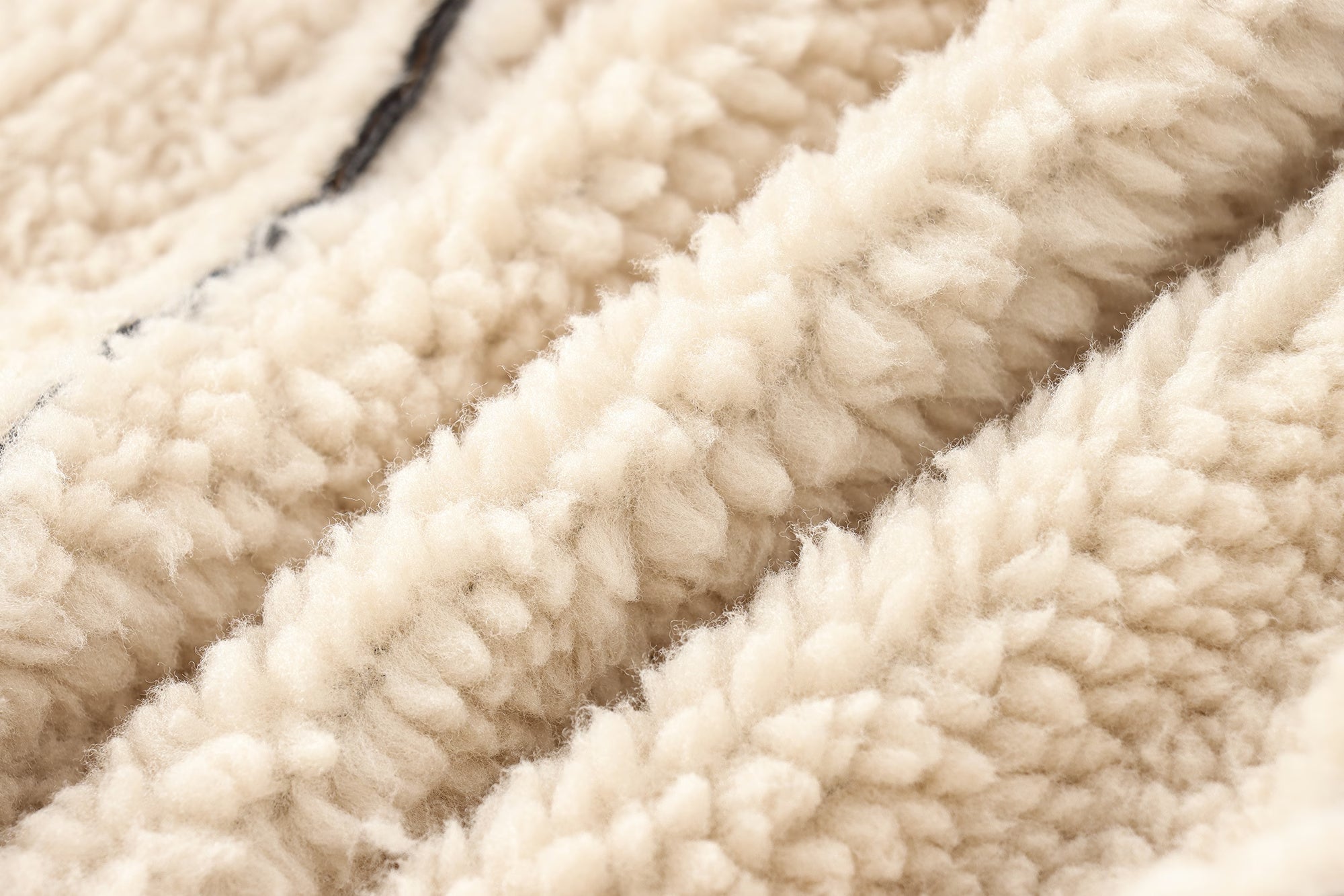Creamy textured fleece fabric from Cozy Leather Jacket, perfect for fashionable ملابس