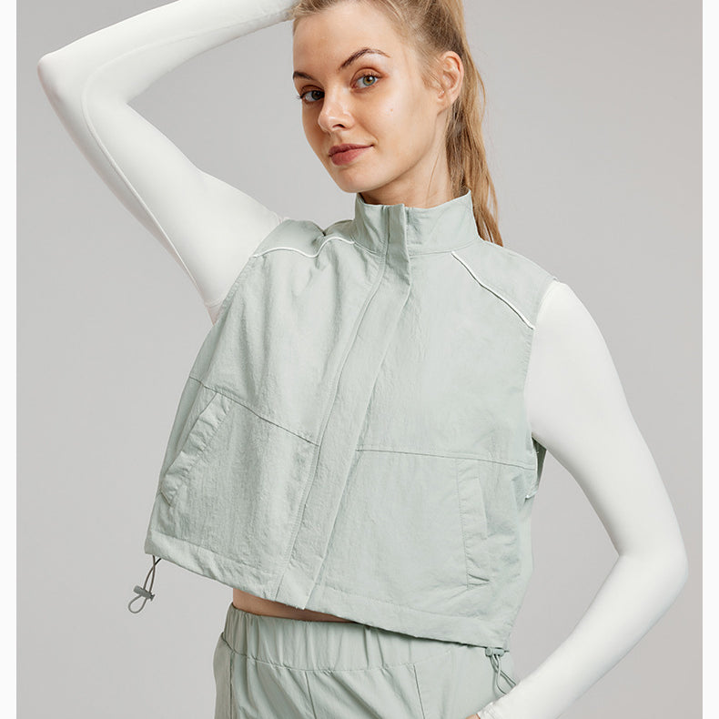 Woman in light green vest and pants showcasing stylish langry fashion ملابس