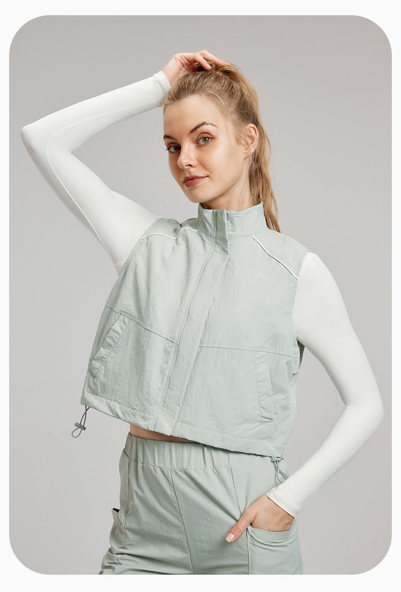 Woman in light green vest and pants showcasing stylish langry fashion ملابس