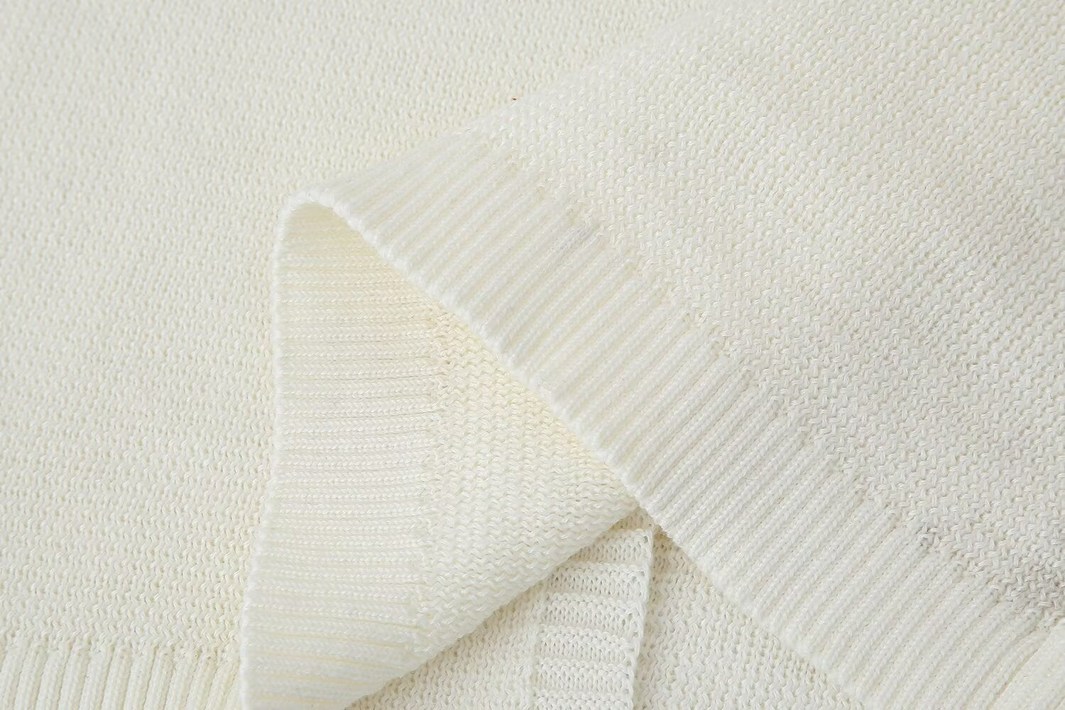 Folded white knit fabric for Slim Casual Knitted Dress showcasing casual knitted style