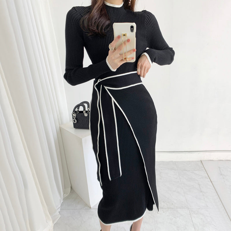 Elegant black ribbed knit fashion dress with white trim for winter language ملابس