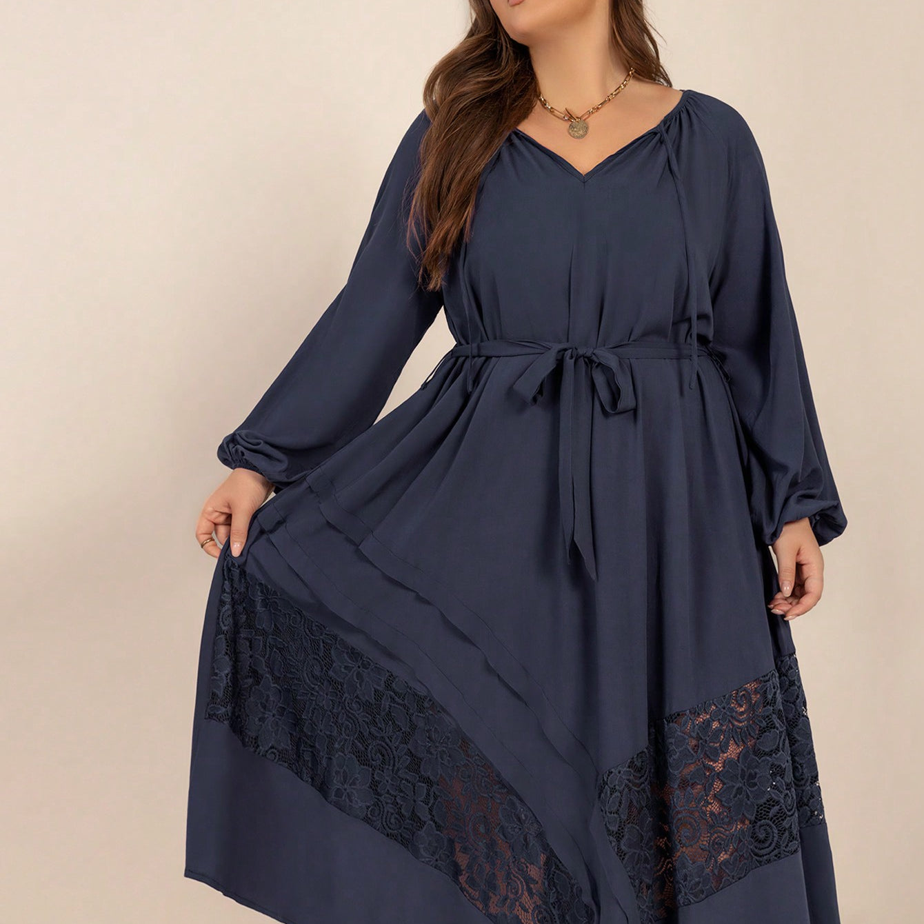 Plus-size navy blue winter cozy dress with lace inserts and tie waist