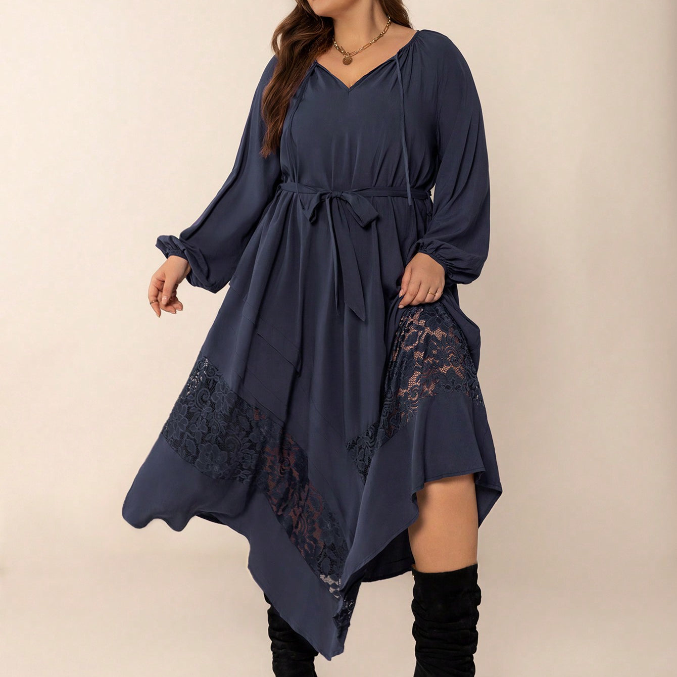 Plus-size navy blue winter cozy dress with balloon sleeves and lace hem detail