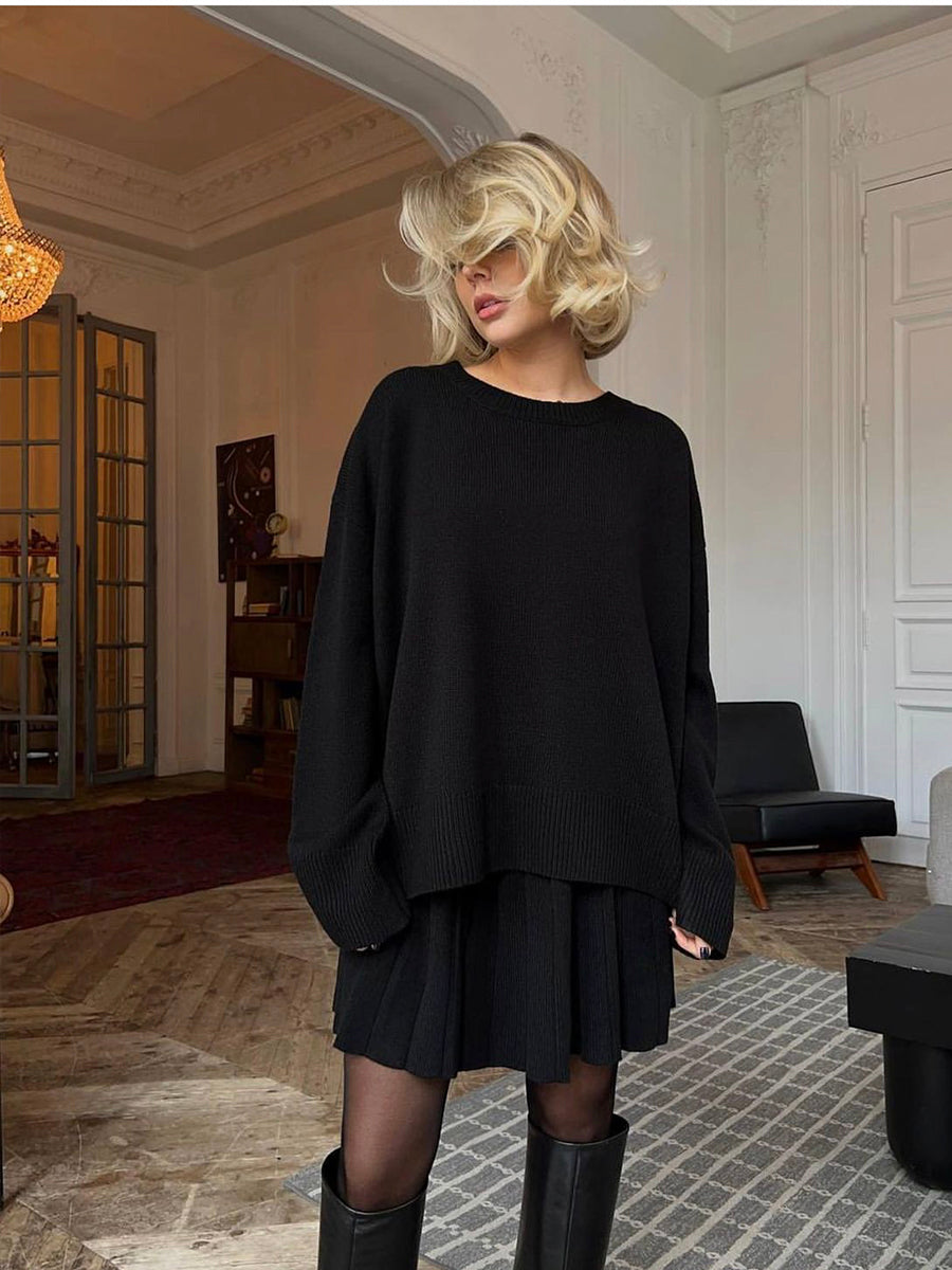 Woman in black oversized sweater and knitted skirt, part of Cute Knitted Skirt Sets collection
