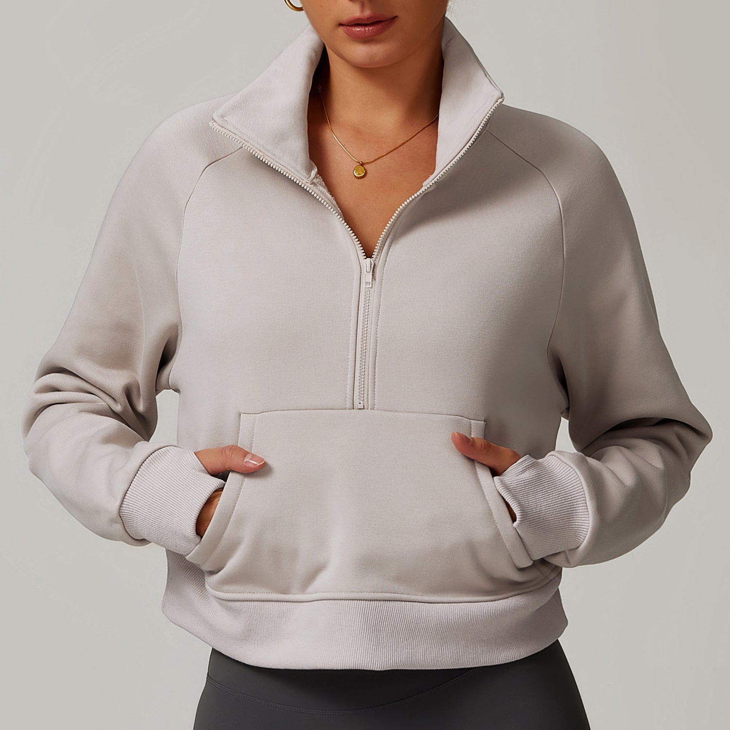 Light gray half-zip pullover sweatshirt with kangaroo pocket for stylish winter fashion