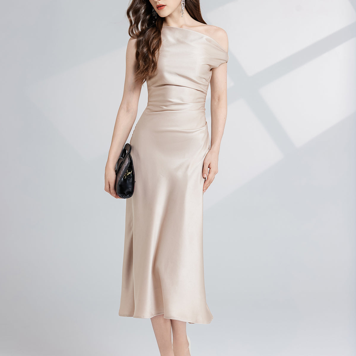 Elegant champagne-colored maxi dress showcasing luxurious fashion and refined style