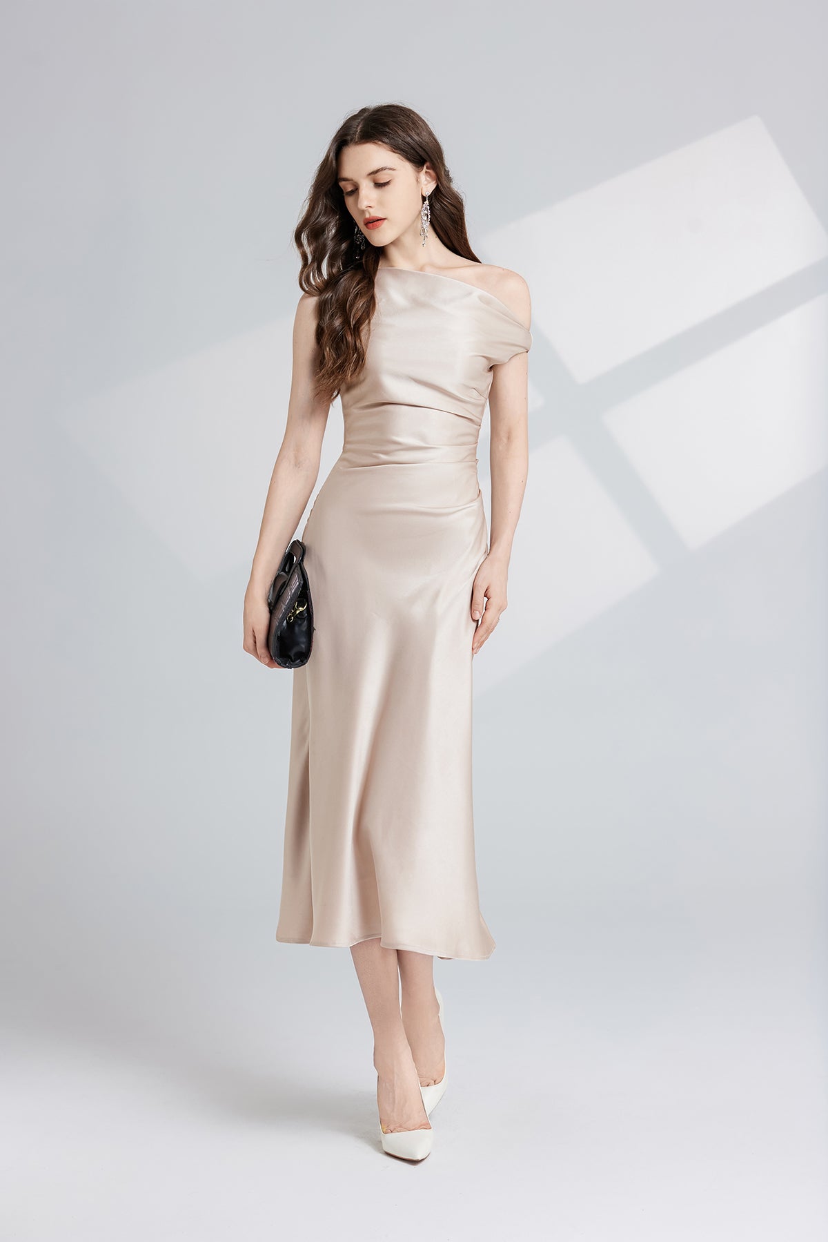 Elegant champagne-colored maxi dress showcasing luxurious fashion and refined style