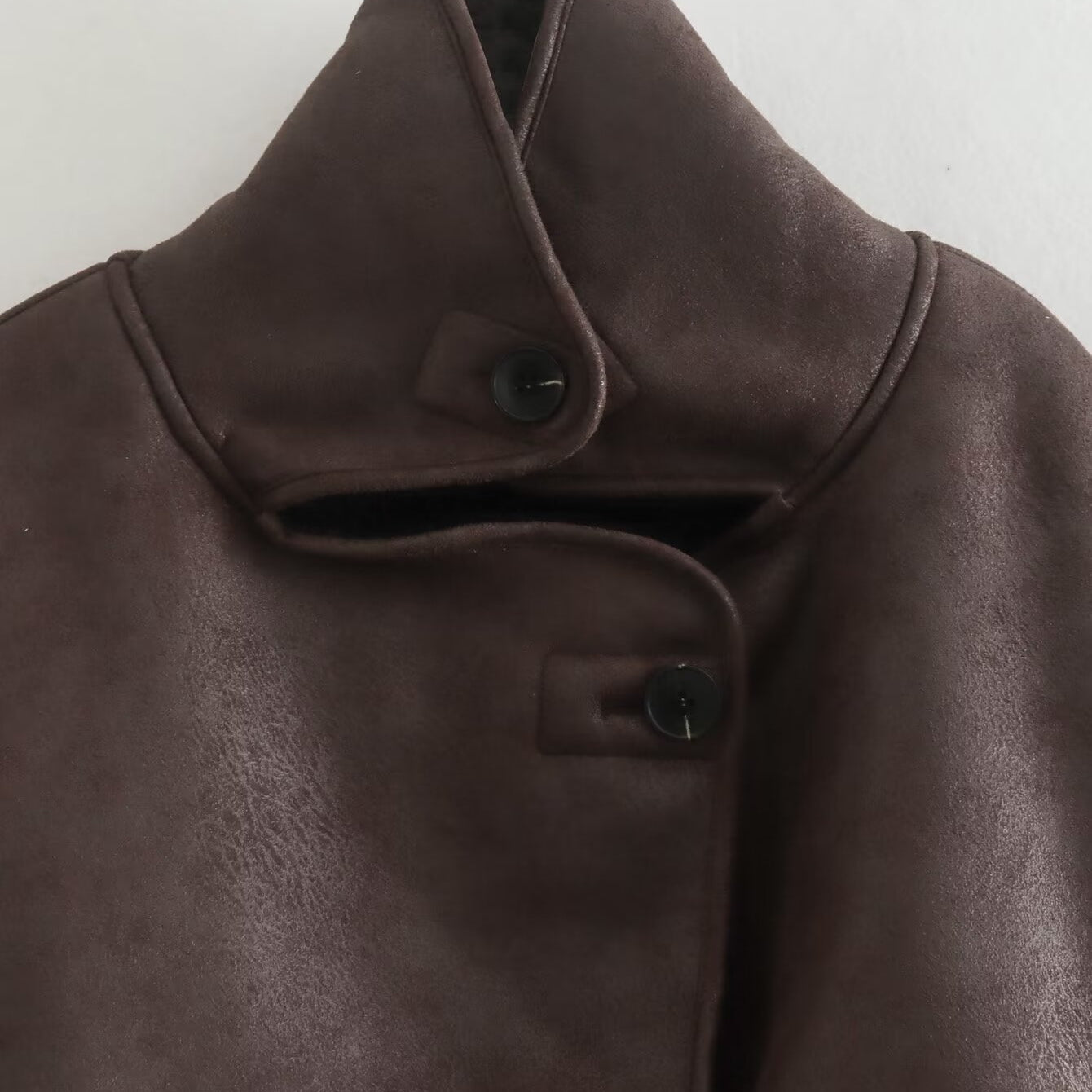 Elegant brown leather Langry fashion jacket with high collar and button closure