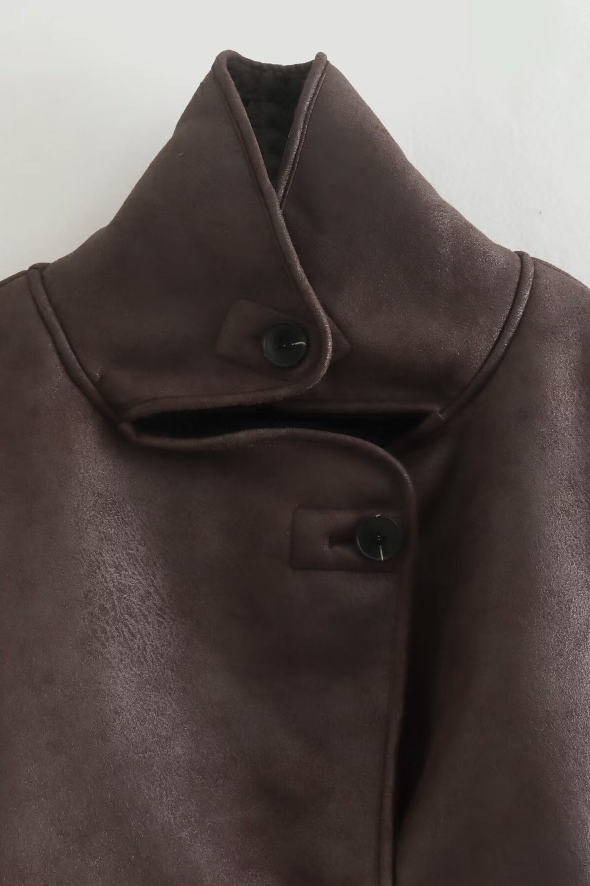 Elegant brown leather Langry fashion jacket with high collar and button closure
