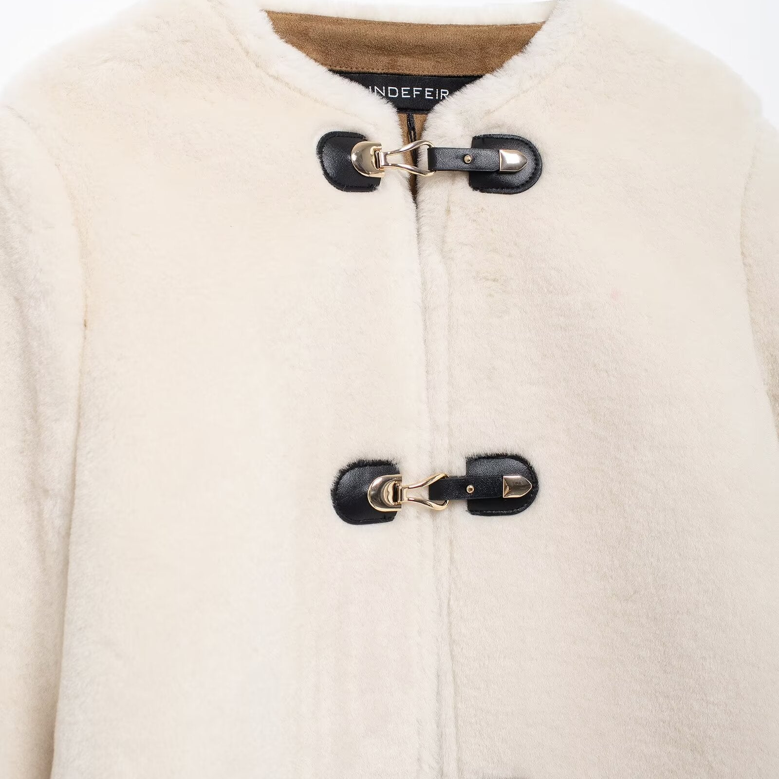Cream-colored faux fur coat with toggle closures from Winter Double Sided String Button Jacket for stylish winter fashion
