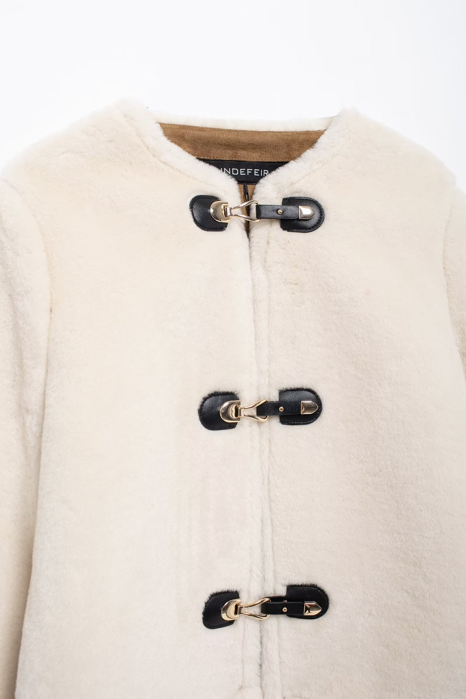 Cream-colored faux fur coat with toggle closures from Winter Double Sided String Button Jacket for stylish winter fashion