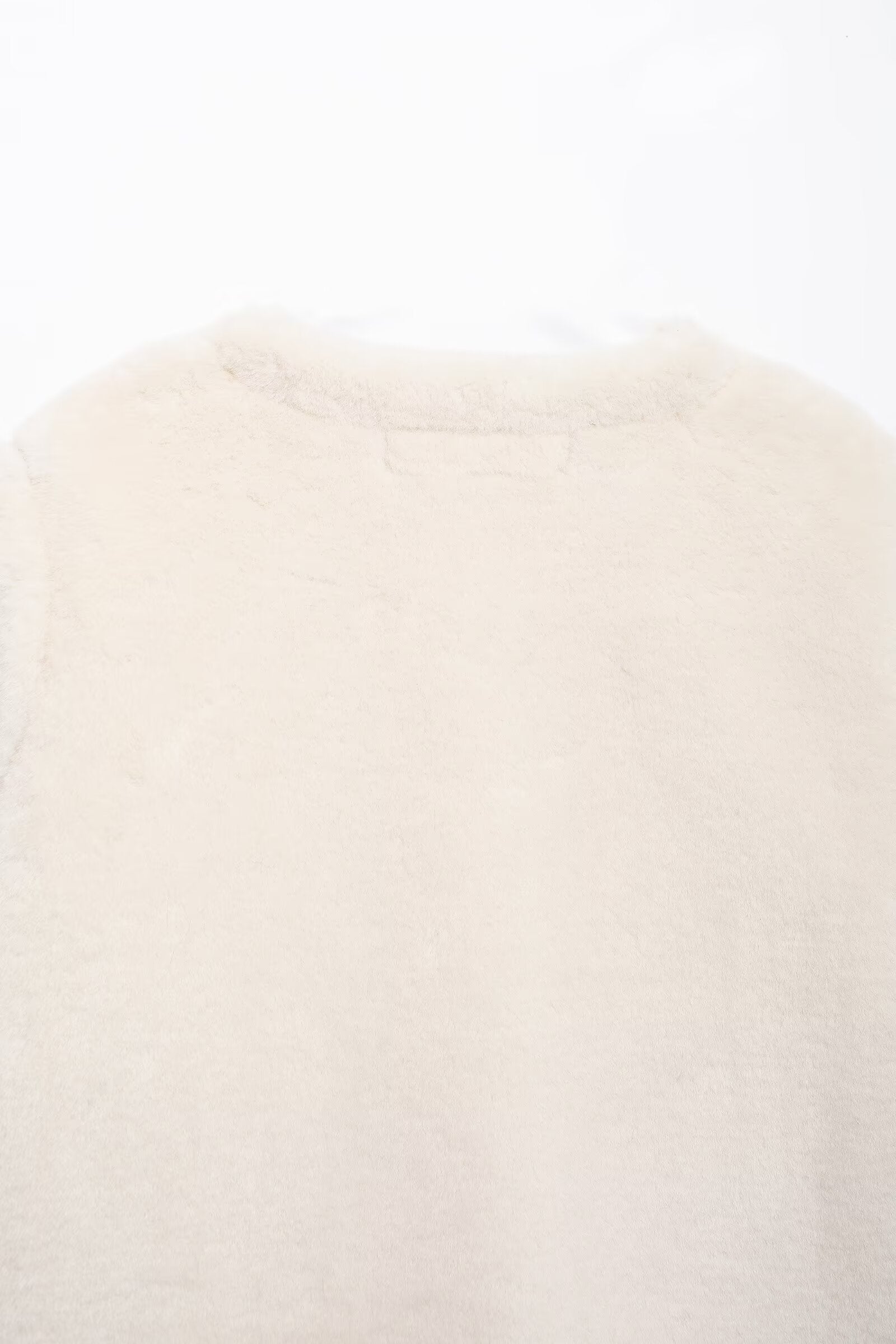 Cream-colored fuzzy sweater with faux fur accents from Winter Double Sided String Button Jacket collection for cozy winter fashion