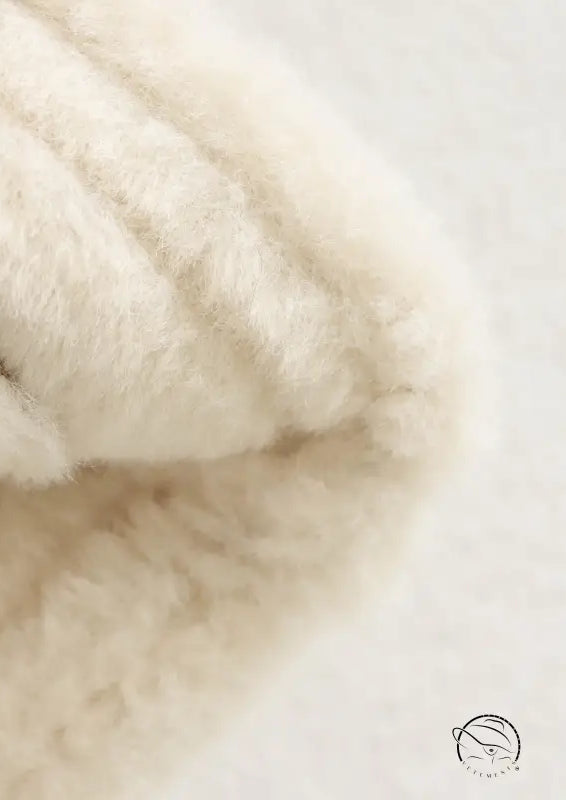 Cream-colored fluffy faux fur scarf on Langry winter fashion suede coat