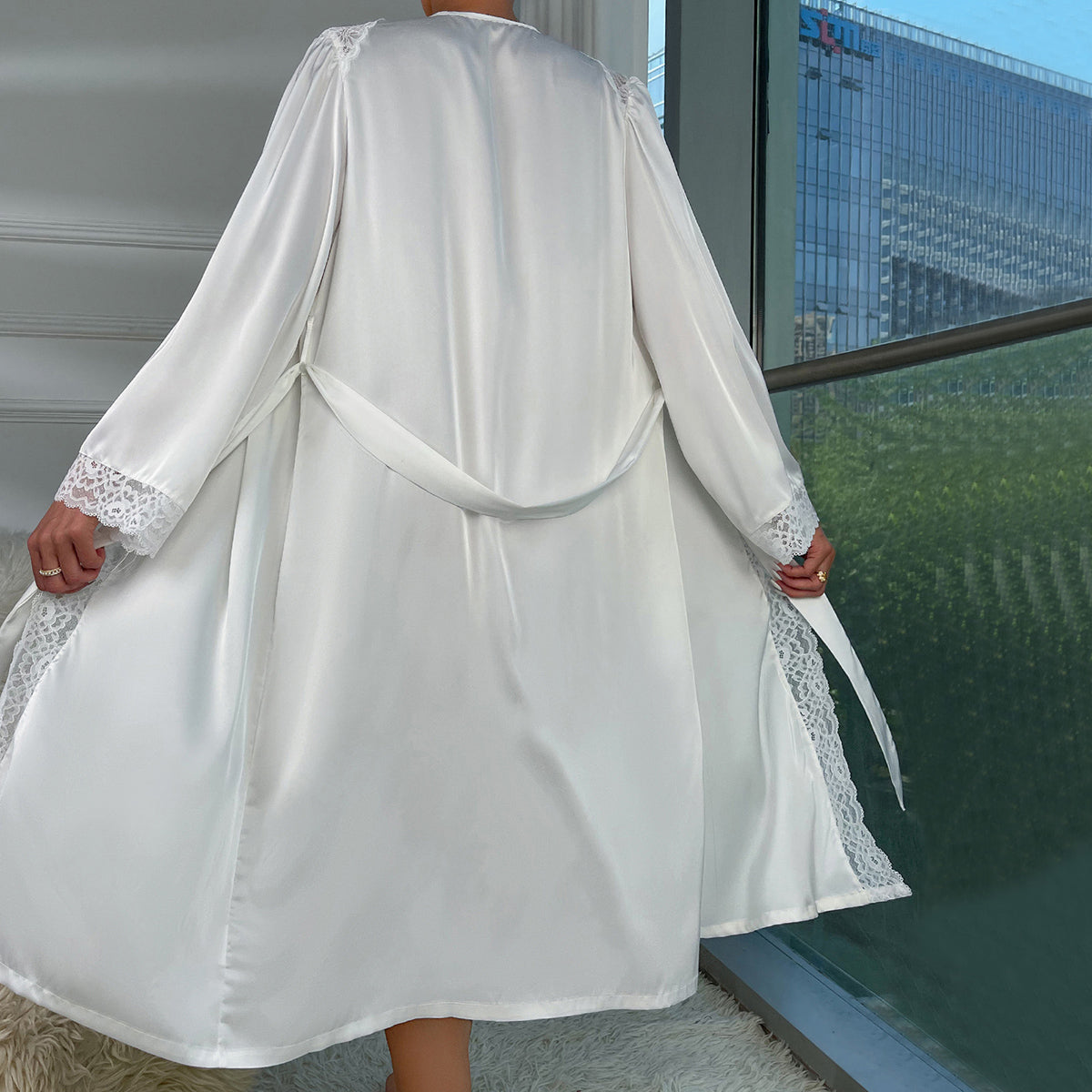 Luxury satin robes featuring lace trim, tie waist, and elegant design for sophisticated comfort