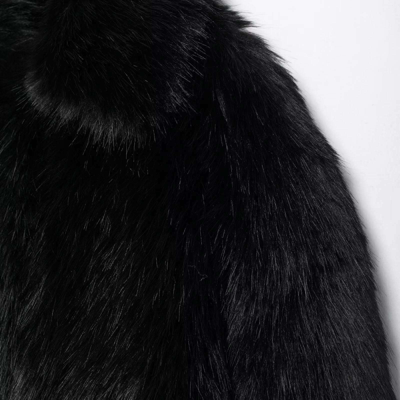 Luxurious black faux fur coat with plush shaggy texture, perfect for fashion and warmth