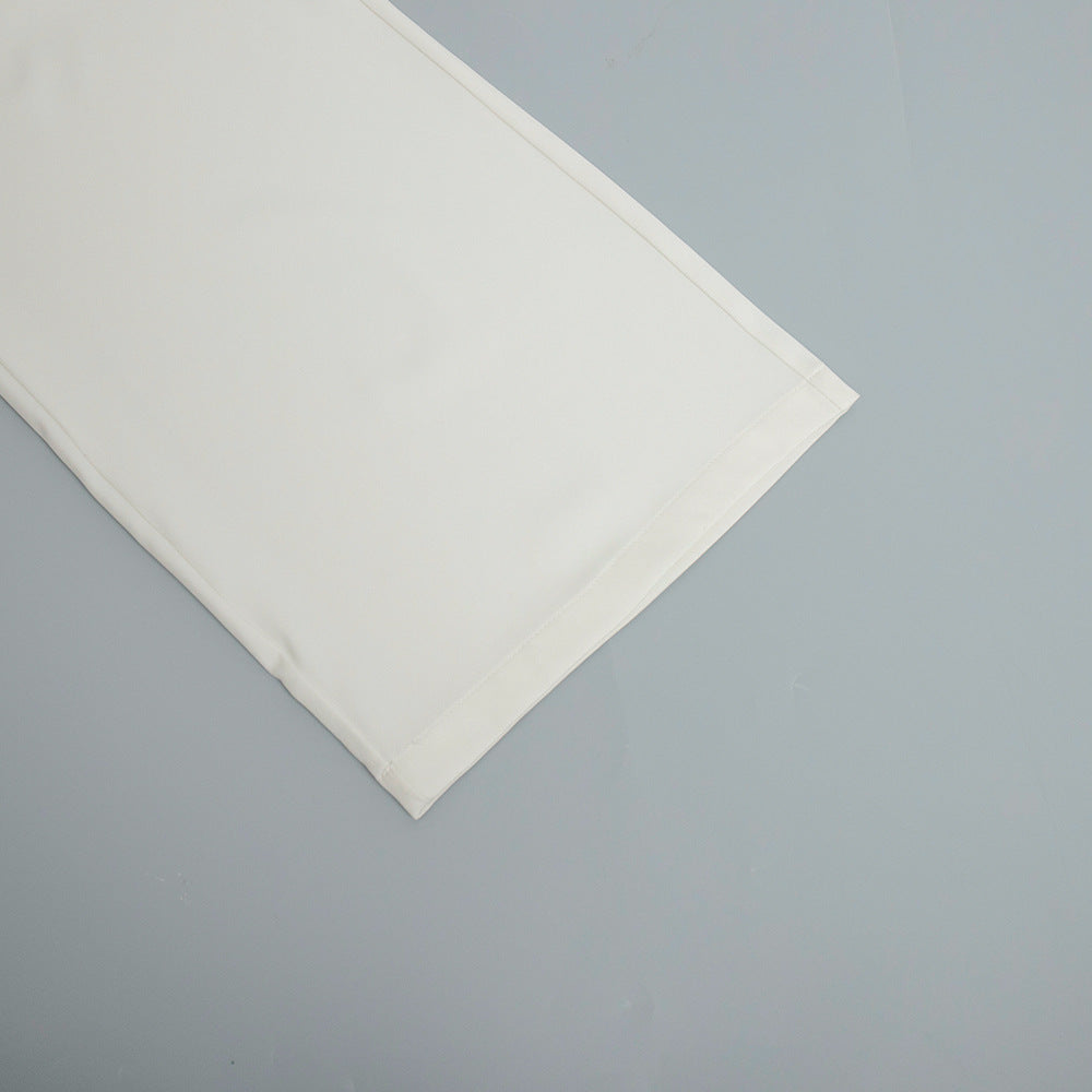 Folded white bedsheet showcasing pure white office matching trousers design