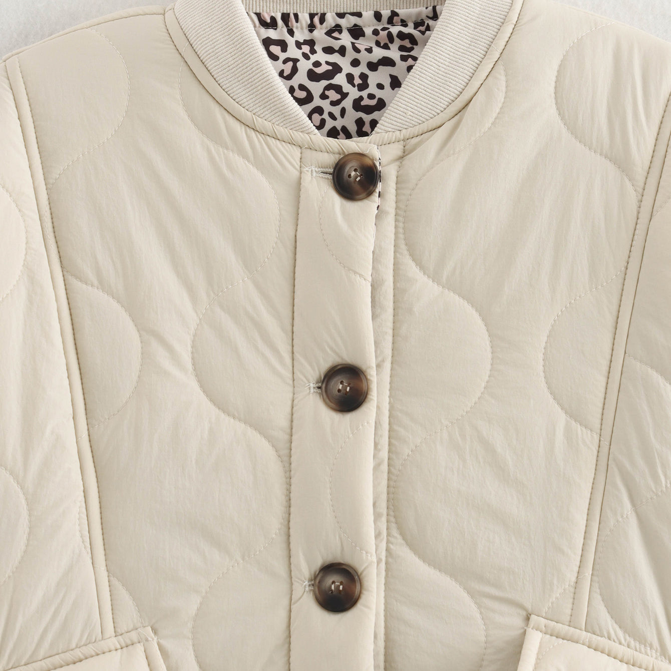 Beige quilted jacket with animal print lining, a stylish langry fashion ملابس piece