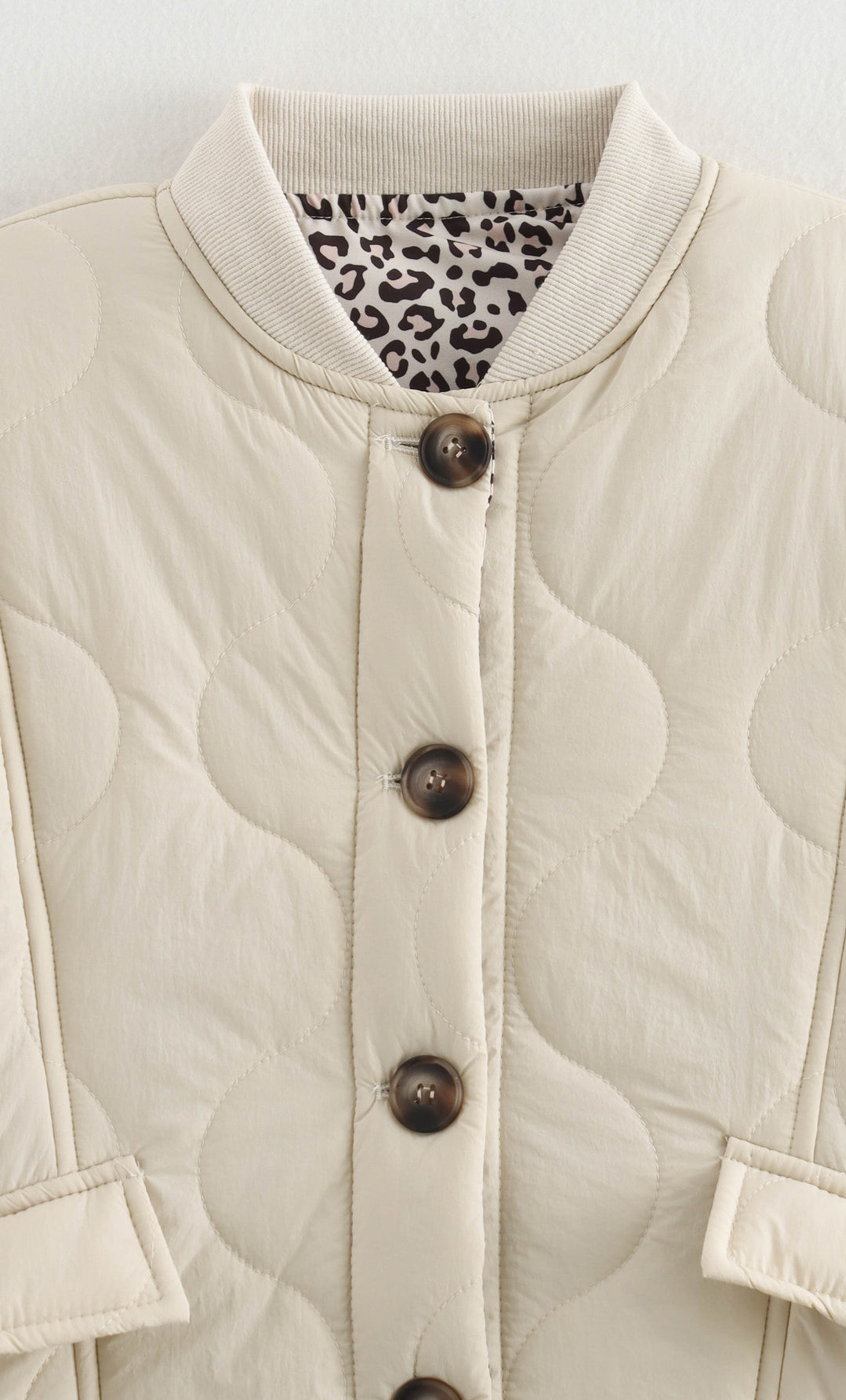 Beige quilted jacket with animal print lining, a stylish langry fashion ملابس piece