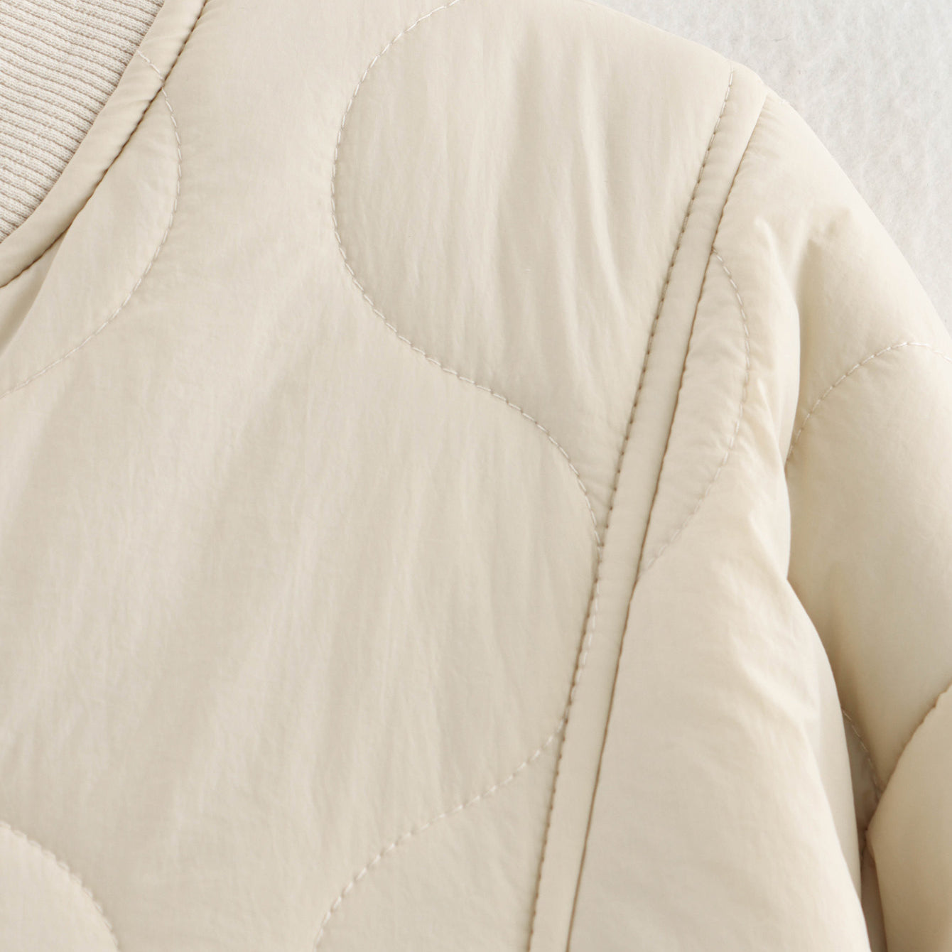 Beige quilted bomber jacket featured in All Match Leopard Print Cotton Coat, a stylish fashion piece