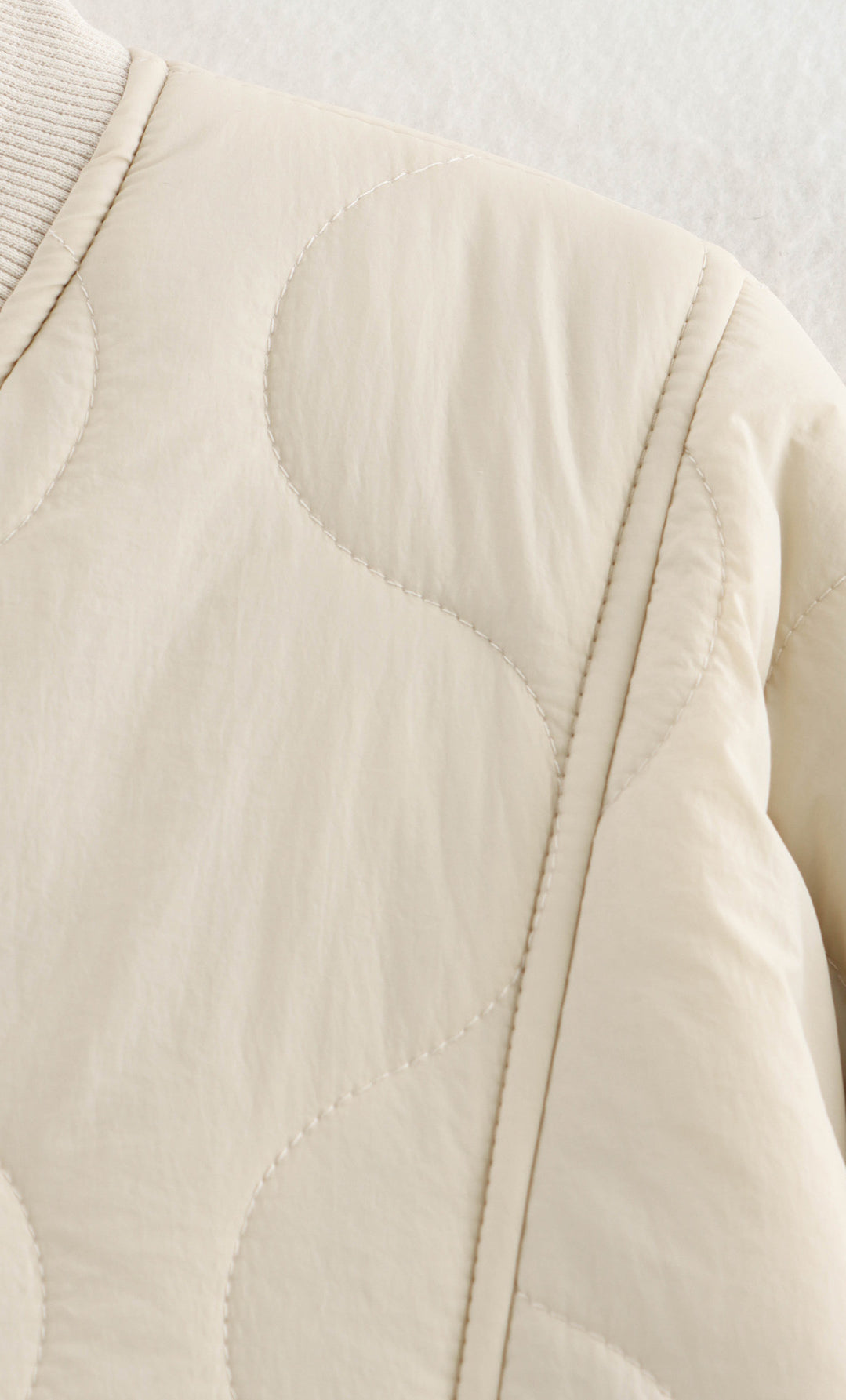 Beige quilted bomber jacket featured in All Match Leopard Print Cotton Coat, a stylish fashion piece