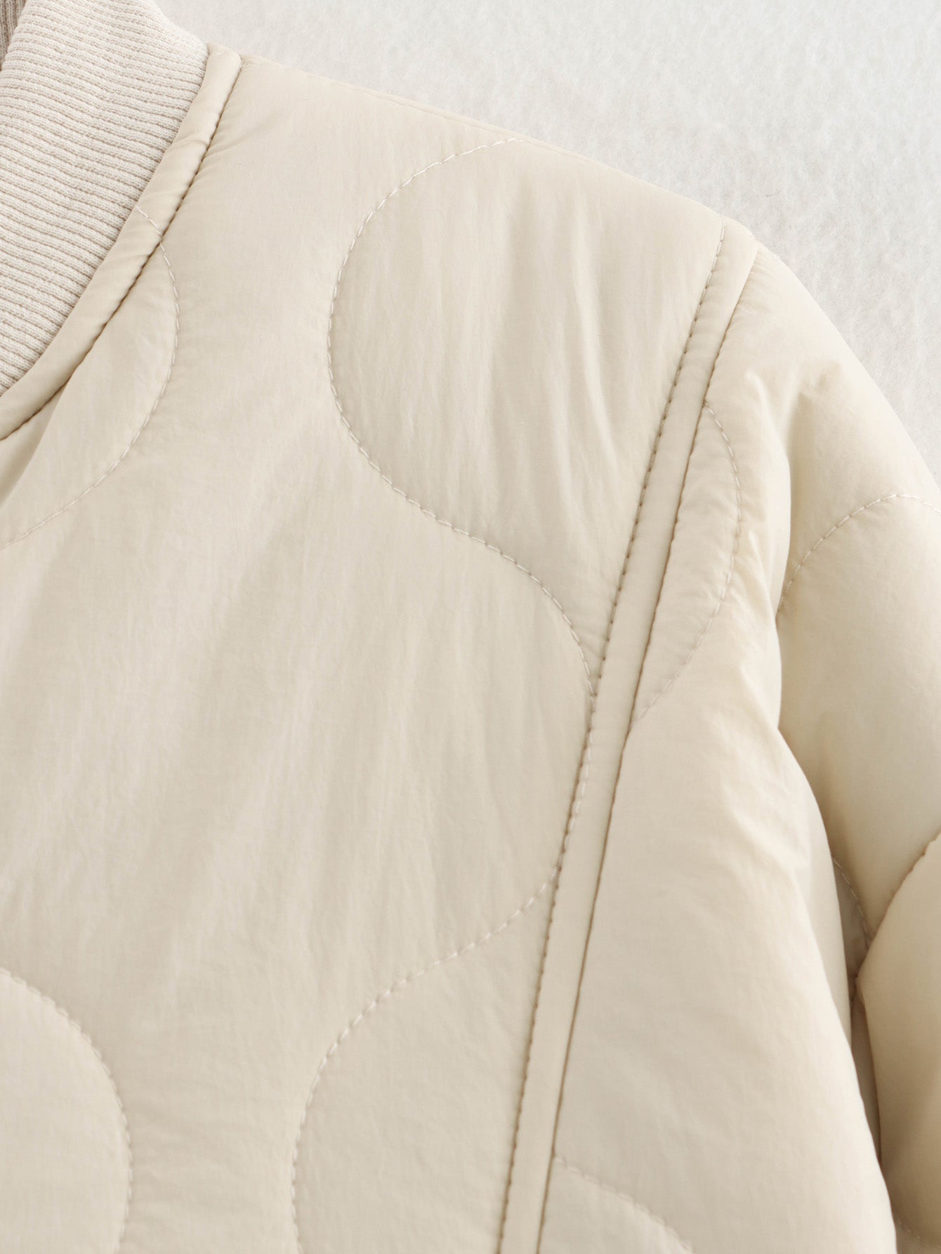 Beige quilted bomber jacket featured in All Match Leopard Print Cotton Coat, a stylish fashion piece