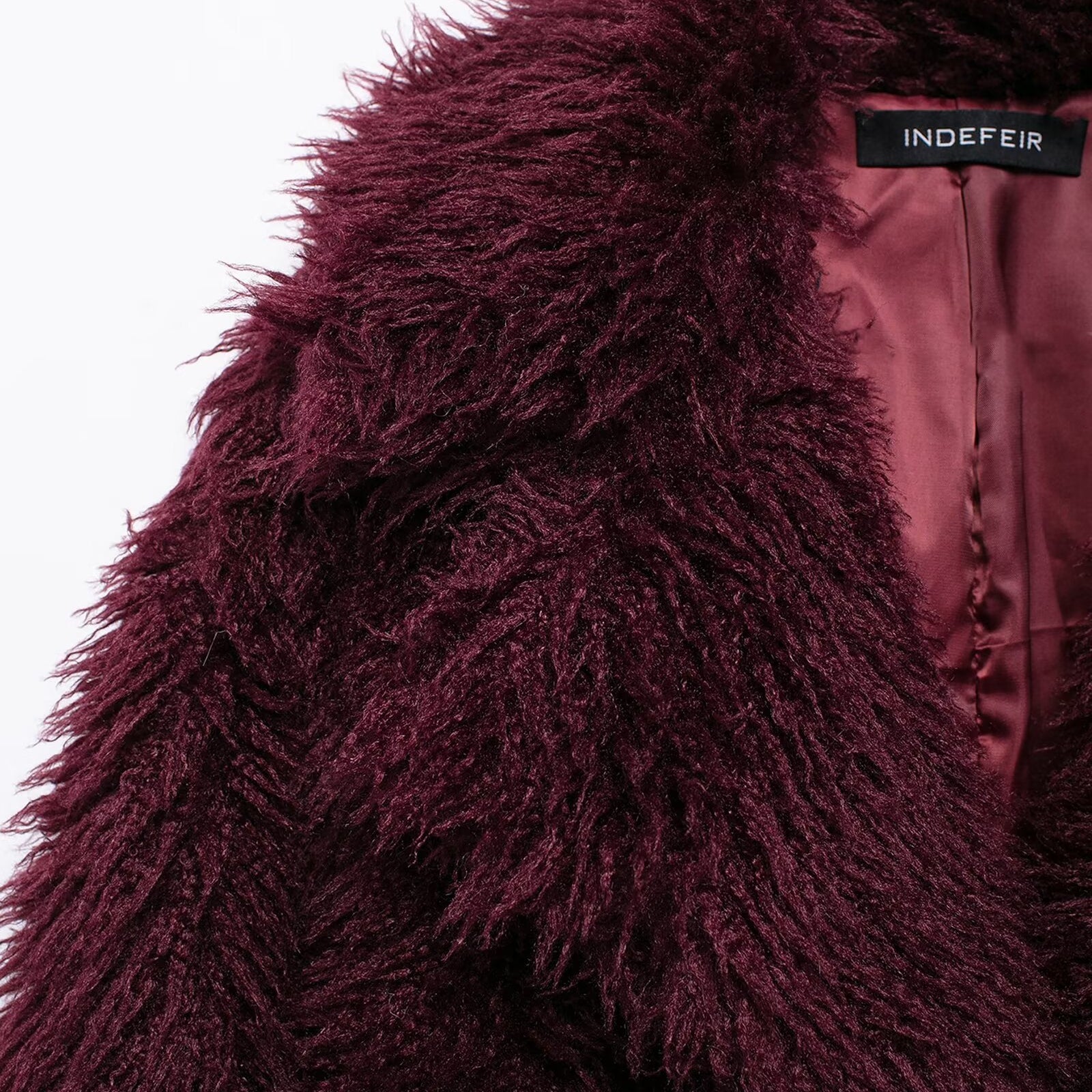Burgundy faux fur coat with INDEFIR label showcasing luxury langry fashion style