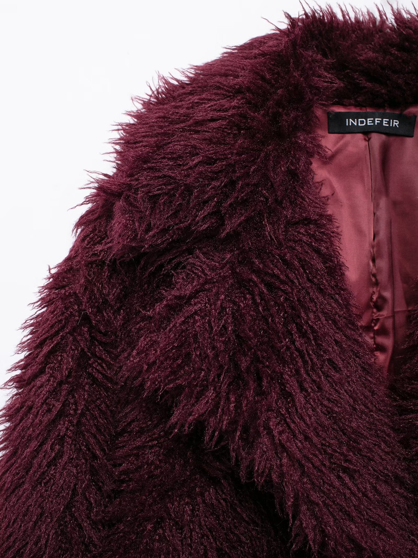 Burgundy faux fur coat with INDEFIR label showcasing luxury langry fashion style