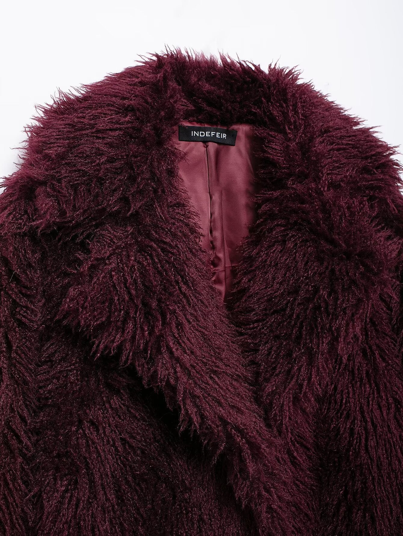 Dark red shaggy faux fur coat showcasing luxurious faux fur fashion style