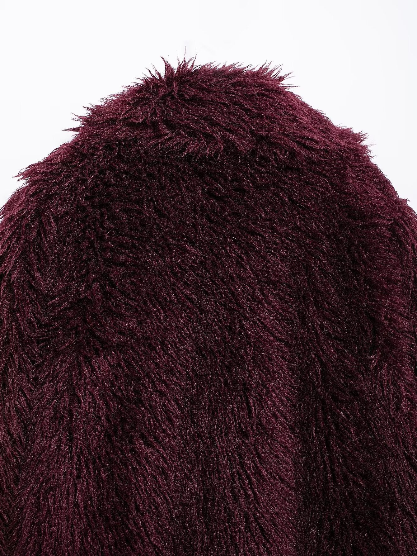 Close-up of maroon faux fur effect mid-length coat showcasing shaggy fashion style