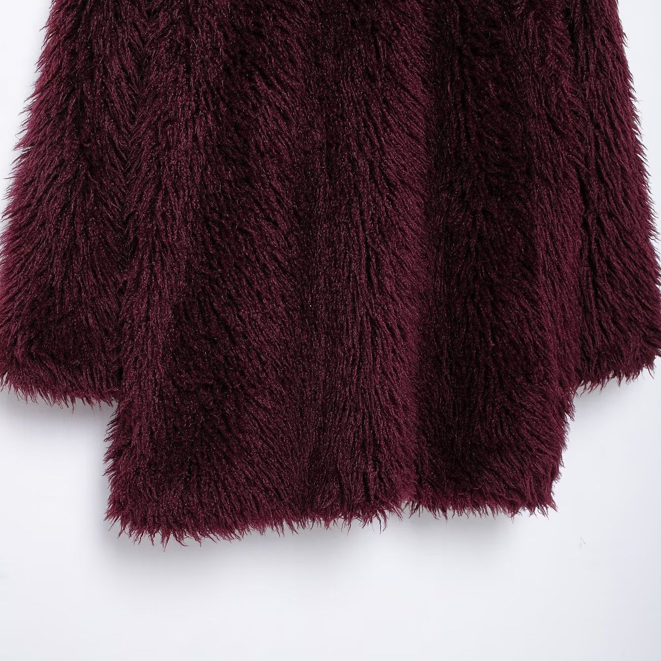 Luxurious dark red faux fur effect mid-length coat showcasing fashionable long-sleeve design