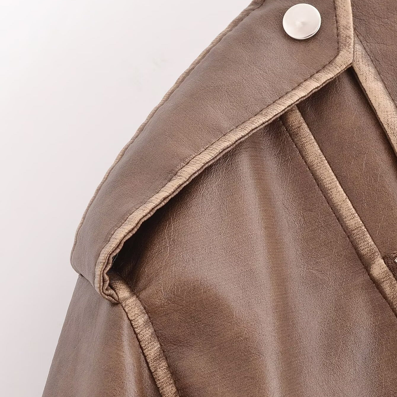 Winter Street faux leather motorcycle jacket with brown leather silver buttons and stitching details