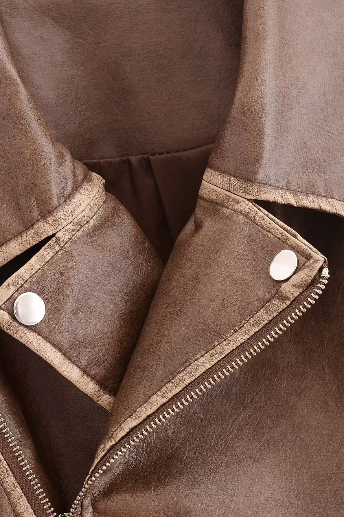 Winter Street faux leather motorcycle jacket in brown with white buttons and zipper details