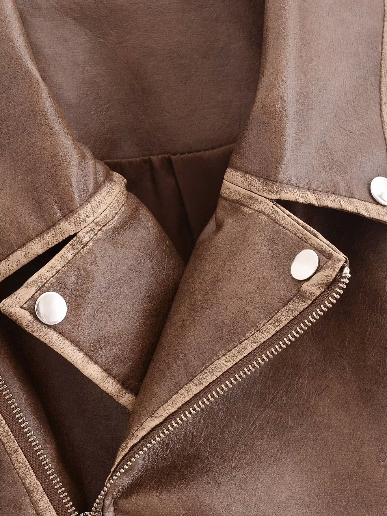 Winter Street faux leather motorcycle jacket in brown with white buttons and zipper details