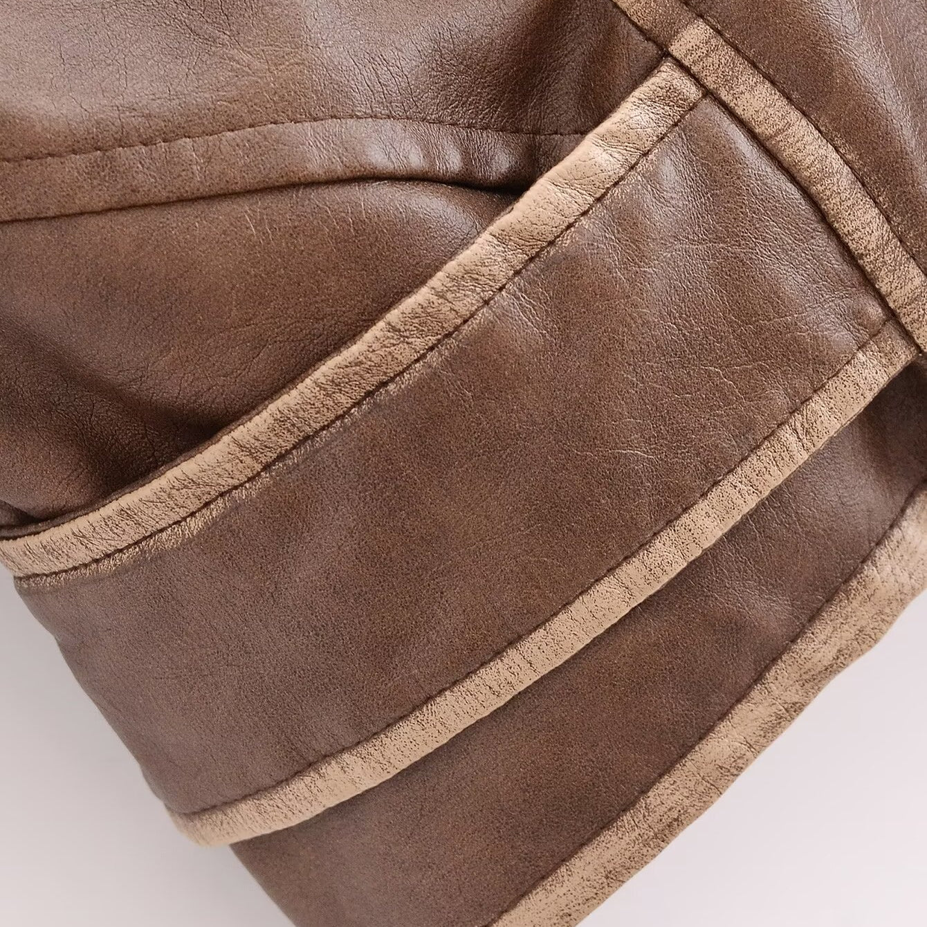 Winter Street faux leather motorcycle jacket in brown with beige trim