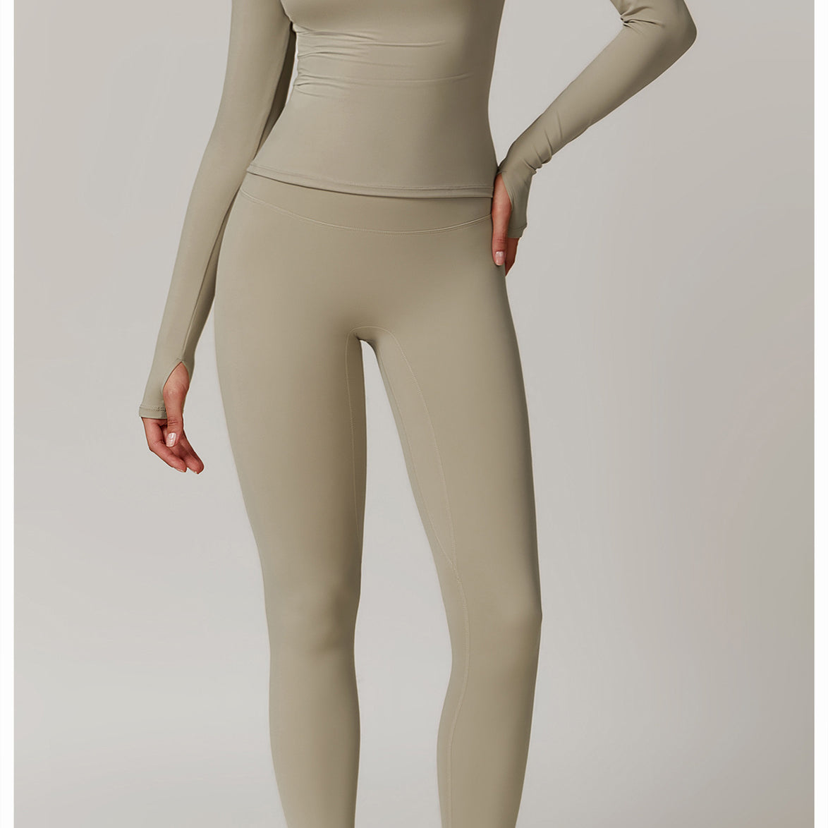 Beige long-sleeved athletic bodysuit and leggings for stylish outdoor running fashion