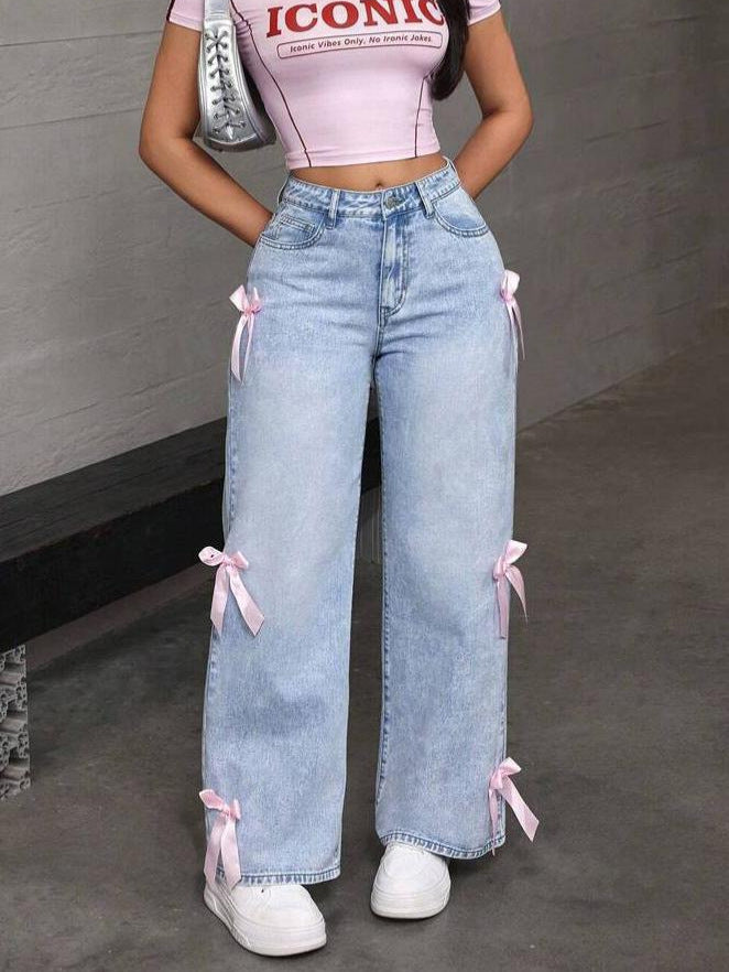 Light wash loose straight leg jeans with pink bow accents, perfect for casual style