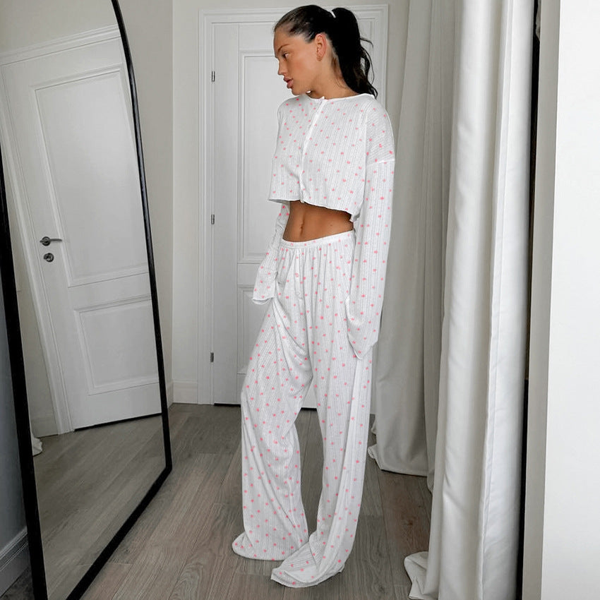 White two-piece pajama set with subtle floral and knitted heart printing design