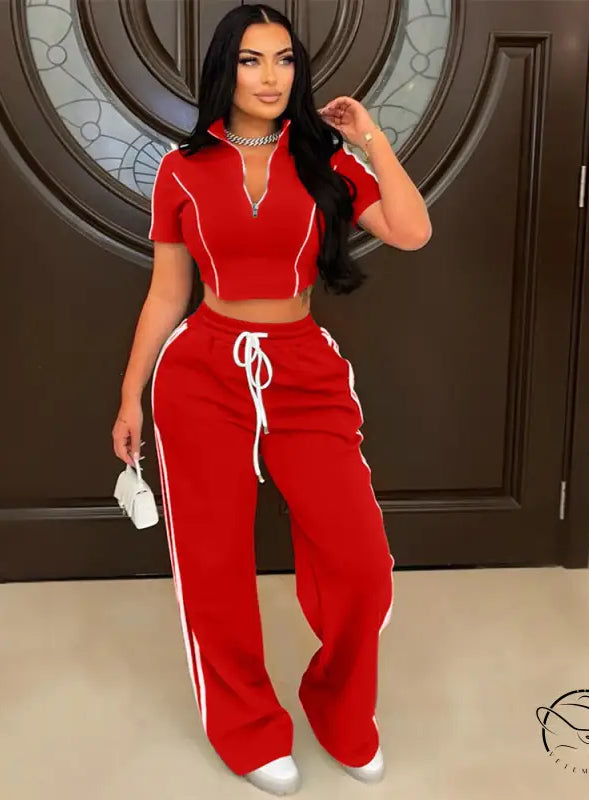 Red polyester tracksuit with white stripes, loose trousers, drawstring waistband