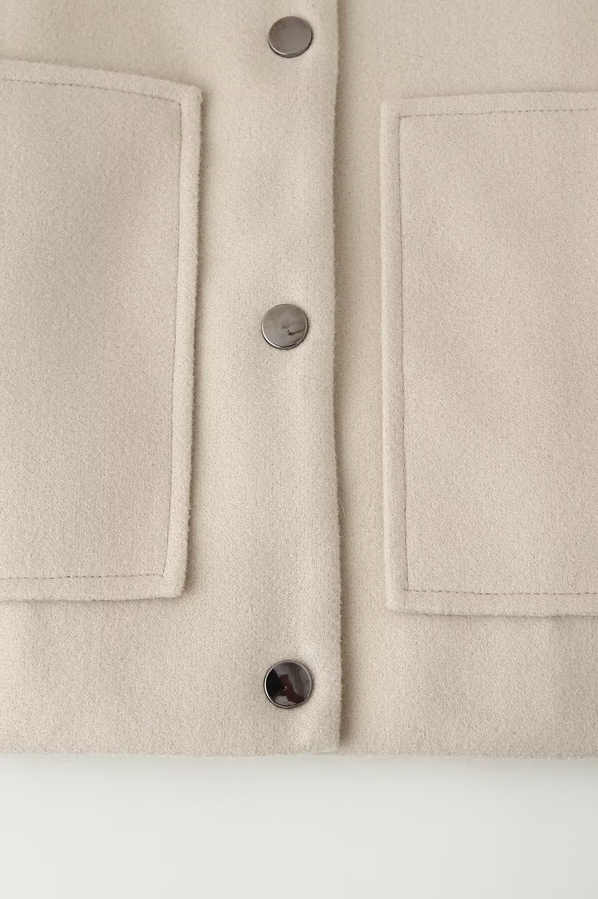 Cream-colored minimalist single breasted Langry fashion jacket coat with pocket details
