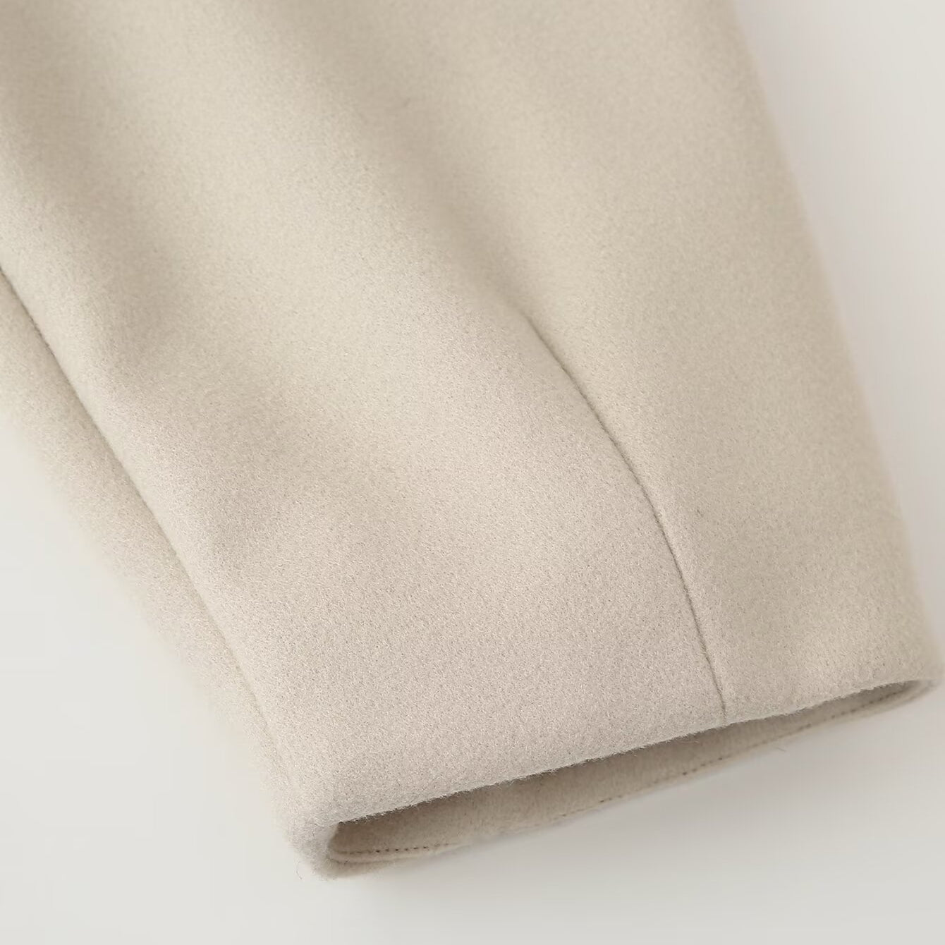 Beige satin blouse with pleated sleeve hem in Langry single breasted jacket