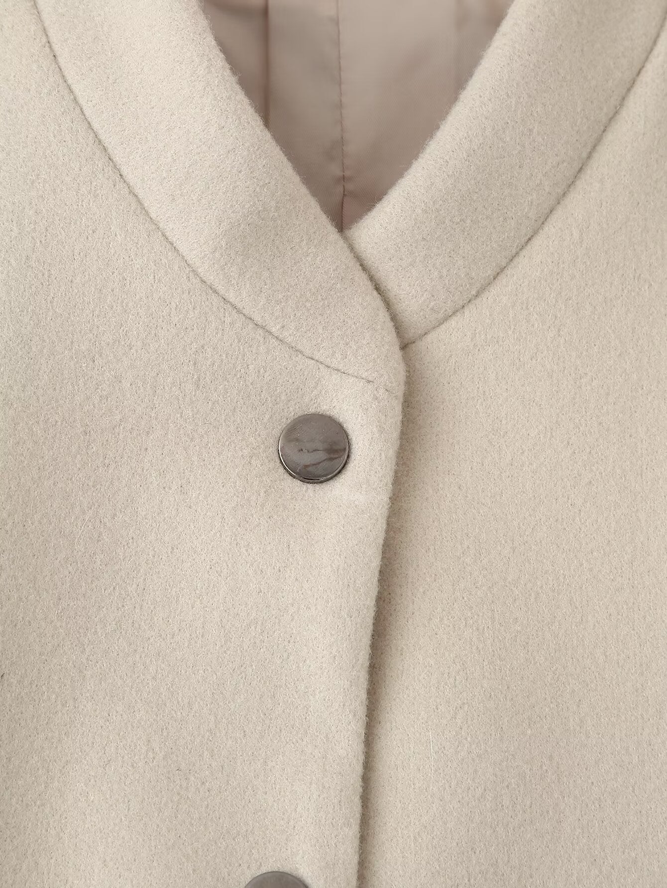 Cream-colored single breasted wool coat with silver buttons