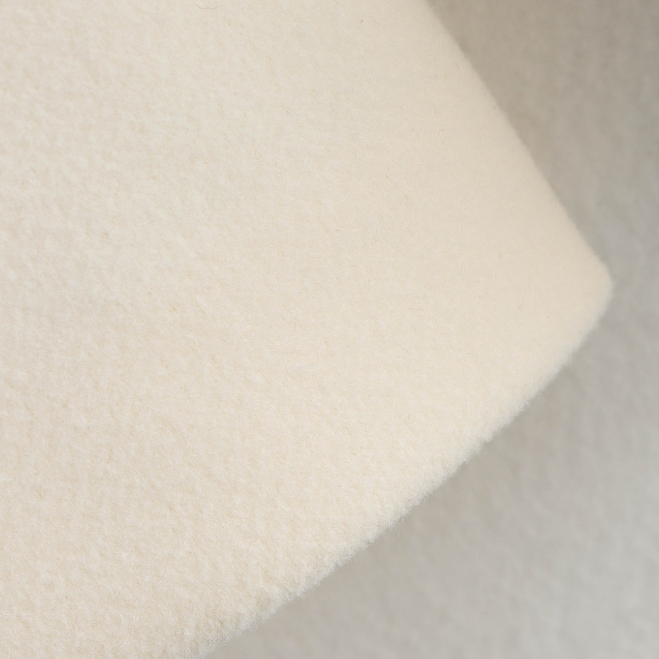 White fluffy bath sponge with textured foam surface for Langry fashion ملابس